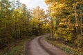 Road less travelled in fall colors Royalty Free Stock Photo