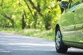 Road trip on beautiful light green car Royalty Free Stock Photo