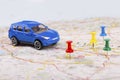 Road trip concept, car with destination points on map Royalty Free Stock Photo