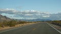 Road trip, driving auto from Death Valley to Las Vegas, Nevada USA. Hitchhiking traveling in America. Highway journey Royalty Free Stock Photo