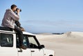 Road Trip, dunes and man in nature for photography, desert landscape and travel for holiday. Pictures, 4x4 and nomad Royalty Free Stock Photo