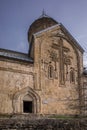 Detailed cross carved in stone wall of church