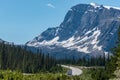Road trip with a great view of big mountain and blue sky in Alberta, Canada Royalty Free Stock Photo