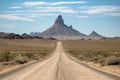 road trip through the heart of the american desert, with towering buttes and mesas in the background