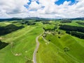 Road trip on rolling hill in Rotorua, New Zealand. Royalty Free Stock Photo