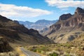 road trip past towering mountains and scenic canyons Royalty Free Stock Photo