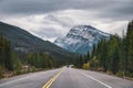 Road trip with Rocky mountains in autumn forest on gloomy at Banff national park Royalty Free Stock Photo