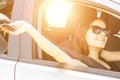 Road trip, teenager girl in summer travel and happy vacation, holidays with friends,woman driver at the wheel in sunglasses Royalty Free Stock Photo