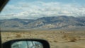 Road trip to Death Valley, driving auto in California, USA. Hitchhiking traveling in America. Highway, mountains and dry Royalty Free Stock Photo
