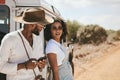 Road trip, travel and black people with smartphone for safari guide app, location update and social media outdoor