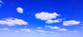 Blue sky background with tiny white clouds, panorama. Royalty Free Stock Photo