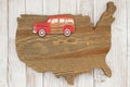 Road Trip USA with old retro car on weathered wood USA map Royalty Free Stock Photo