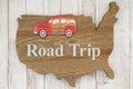 Road Trip USA with old retro car on weathered wood USA map Royalty Free Stock Photo