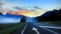 The Road trip view of travel with mountain view of autumn scene and foggy in the morning with sunrise sky scene at fiordlan Royalty Free Stock Photo