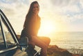 Road trip, vintage sunset and woman in portrait by sea for travel, journey and happy summer vacation. Youth, gen z Royalty Free Stock Photo