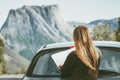 Road trip Woman car driver with map planning journey route in Norway Travel Lifestyle concept adventure vacations outdoor rocky mo