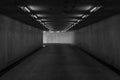 Road tunnel black and white, night illuminated, Urban tunnel without traffic, illuminated city highway tunnel with spotlights Royalty Free Stock Photo