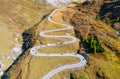 A road with turns through a mountain pass. Aerial landscape. An aerial summer landscape in the Dolomite Alps, Italy. Royalty Free Stock Photo