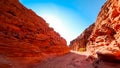 road between two red rocks located in the desert Royalty Free Stock Photo