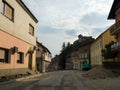 Road under construction in Doboj and famous fortress on hill above city during cloudy summer day