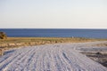 Road under construction. Gravel poured in the steppe as a substrate in front of asphalt