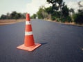 The road is under construction and has a red rubber cone on the road Royalty Free Stock Photo