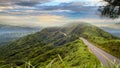 Road under a sunrise time with nice sky with soft clouds Royalty Free Stock Photo