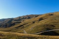 Road through the unevenness of the Bosnian mountain Bjelasnica. It has a golden color before sunset