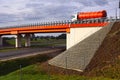 Road viaduct over the highway. In the foreground there is a bridge abutment Royalty Free Stock Photo