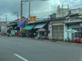 Road view with buildings and shops on roadside in city Ho Chi Minh in Vietnam