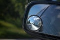 Road view in a car mirror reflection Royalty Free Stock Photo