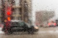 Road view through car window with rain drops and melting snow Royalty Free Stock Photo