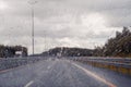 Road view through windshield car window with going rain drops during driving at speed. Unfocused highway. Autumn. Royalty Free Stock Photo