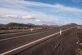 Road in volcanic landscape in Lanzarote, Canary islands, Spain.