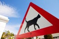 Road warning sign indicating cats are crossing