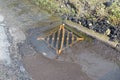 Road water drainage cover. Royalty Free Stock Photo