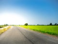 Road way on green meadow In the blue sky Royalty Free Stock Photo