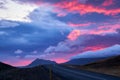 Road in Western Iceland at sunset time with dramatic sky