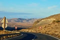 road and clouds near the mountains Royalty Free Stock Photo