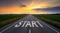 Road with a white start sign on it Royalty Free Stock Photo