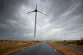 Road between wind turbines in Holland Royalty Free Stock Photo