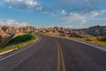 Road Winds Through Badlands Rock Formations