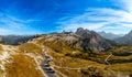 Road at foot of rocky mountain in Tre Cime di Lavaredo Royalty Free Stock Photo