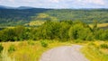 road winds through the lush green countryside