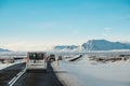 On the road in winter, with a cars driving on highway in Iceland