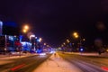 Road in the winter night, city, cars, lights, speed Royalty Free Stock Photo
