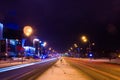 Road in the winter night, city, cars, lights, speed Royalty Free Stock Photo