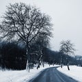 Road in winter. Snowy mountain path for a car. Concept for traveling and safe driving in winter by car Royalty Free Stock Photo