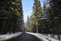 Road in winter. Snowy mountain path for a car. Concept for traveling and safe driving in winter by car Royalty Free Stock Photo