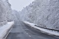 Road in winter. Snowy mountain path for a car. Concept for traveling and safe driving in winter by car Royalty Free Stock Photo